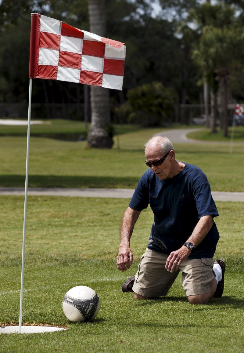 FootGolfer Bobby Rodriguez drops to his knees after missing a putt at Largo Golf Course.