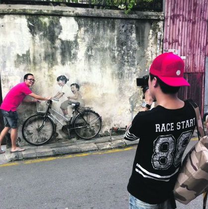 Yes, the mural everyone wants to pose with: The Little Children on a Bicycle. — Pic courtesy of Ernest Zacharevic