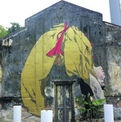 Flipping over Ernest Zacharevic’s paintings at the once abandoned Hin Bus Depot in George Town, which has become an art gallery of sorts. — Pic courtesy of Ernest Zacharevic