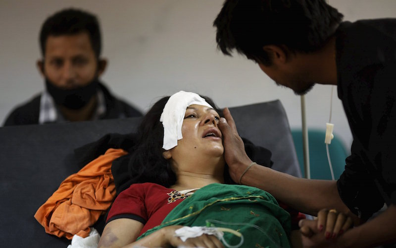 A boy comforts his mother who was injured during an earthquake, at a trauma centre in Kathmandu, Nepal April 26, 2015. u00e2u20acu201d Reuters pic