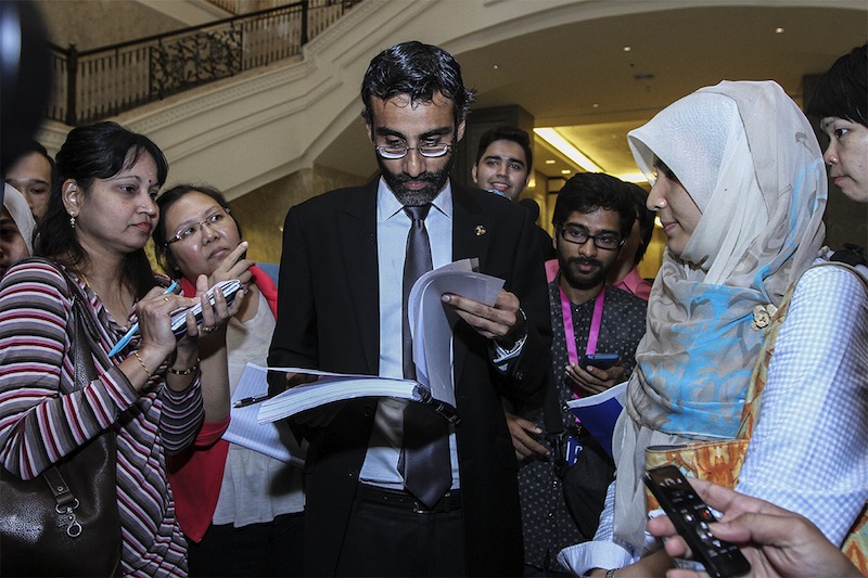 Datuk Seri Anwar Ibrahim's lawyer N. Surendran and daughter Nurul Izzah Anwar speaks to the media after the Opposition Leader applied for a review of his sodomy conviction at the Federal Court in Putrajaya, April 30, 2015. u00e2u20acu201d Picture by Yusof Mat Isa 