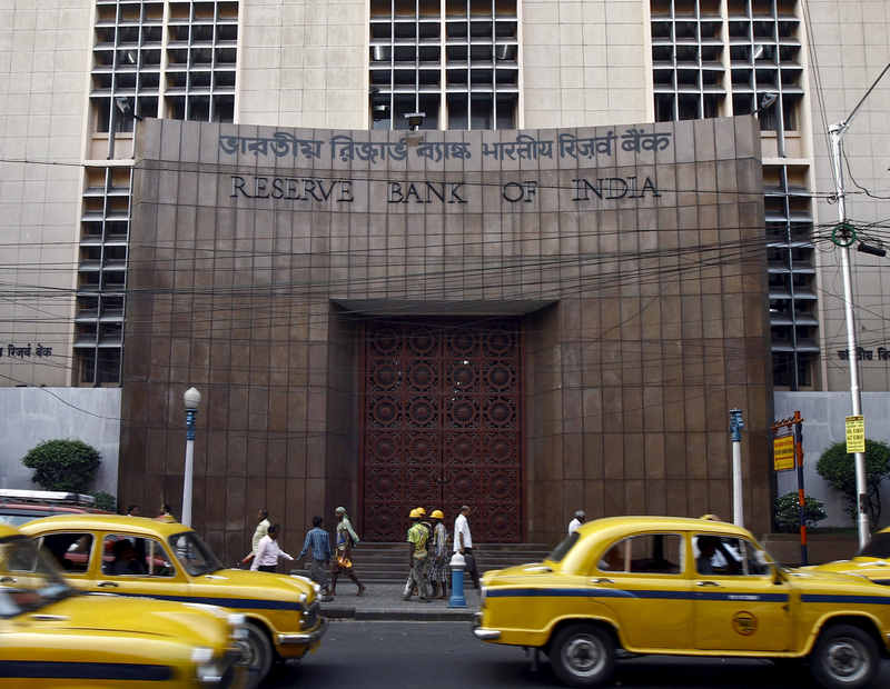 Commuters travel past a Reserve Bank of India building in Kolkata, November 11, 2014. u00e2u20acu201d Reuters pic