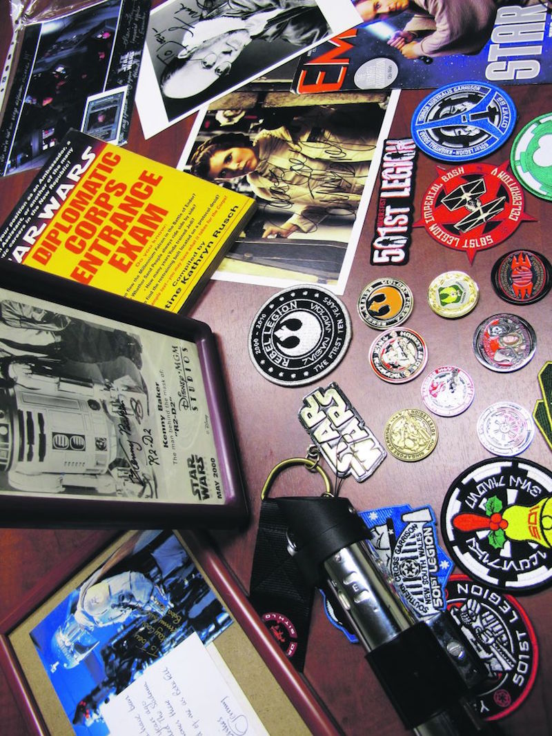 Some of the ‘Star Wars’ memorabilia Joey Lim, Olivine Lin and Tyrene Teo have collected into 501st Legion patches, autographed photos and replicas. — Today pic