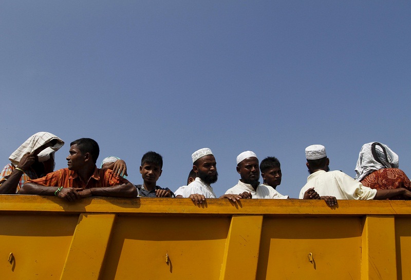 A group of Rohingya and Bangladeshi migrants, who arrived in Indonesia by boat this week, move to a new shelter in Lhoksukon, Indonesia‘s Aceh Province May 13, 2015. — Reuters pic