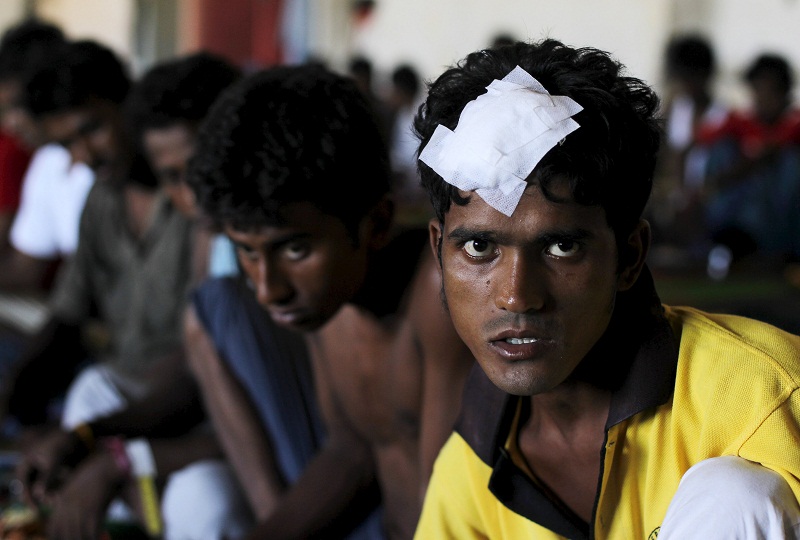 Rohingya migrants, who recently arrived in Indonesia by boat, sit while waiting for their breakfast inside a shelter in Kuala Langsa, in Indonesiau00e2u20acu02dcs Aceh Province, May 19, 2015. u00e2u20acu201d Reuters pic