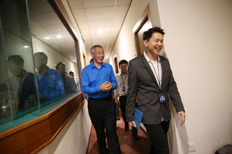 Singapore PM Lee Hsien Loong leaving the Capital 95.8FM radio studio with MediaCorp chief executive officer Shaun Seow shortly after participating in a radio show segment. u00e2u20acu201d TODAY pic