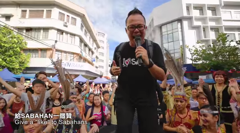 A screen capture of the music video u00e2u20acu02dcI love Sino Kadazanu00e2u20acu2122 showing Johor-born Yu Tian Long. 