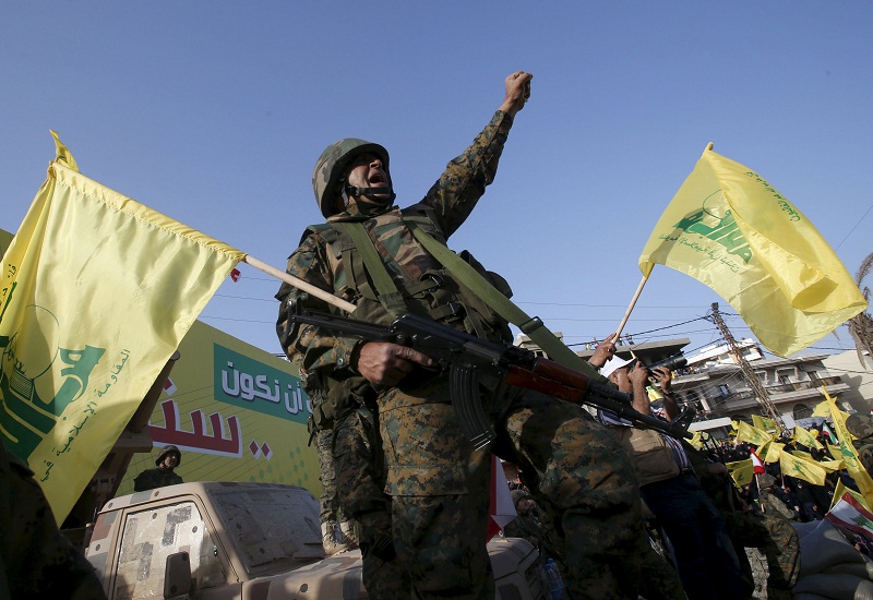 A Hezbollah member reacts while Hezbollah leader Sayyed Hassan Nasrallah talks on a screen during a televised speech at a festival celebrating Resistance and Liberation Day, in Nabatiyeh May 24, 2015. u00e2u20acu201d Reuters pic