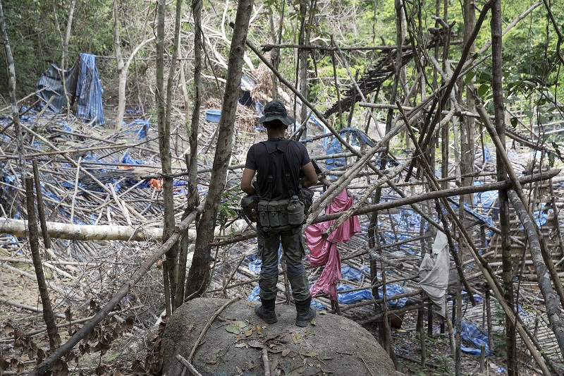 A policeman watches over abandoned human trafficking camp in the jungle close the Thailand border at Bukit Wang Kelian in northern Malaysia May 26, 2015. u00e2u20acu201d Reuters pic