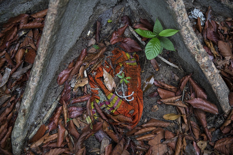 Clothes are photographed near abandoned human trafficking camp in the jungle close the Thailand border at Bukit Wang Kelian in northern Malaysia May 26, 2015. — Reuters pic