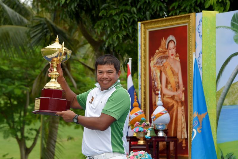 In this handout photograph taken and received from the Asian Tour on June 21, 2015 Prayad Marksaeng of Thailand holds the winneru00e2u20acu2122s trophy after winning the Queen's Cup at Santiburi Samui Country Club in Koh Samui. u00e2u20acu201d AFP pic