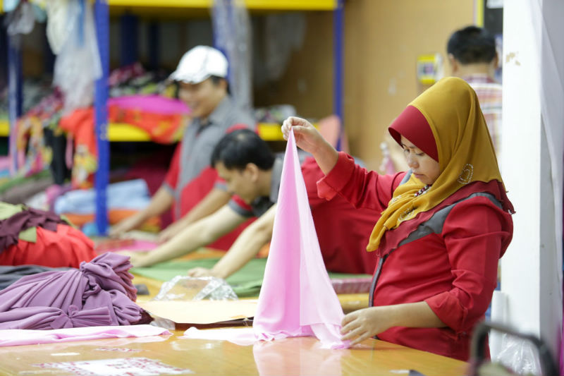 Workers making headscarves in Fareeda's Bangi store on April 30, 2015.