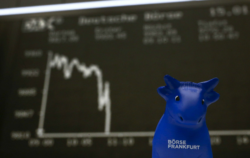 File picture shows a bull figurine, the symbol of the Frankfurt stock exchange, in front of the German share price index DAX board at the Frankfurt stock exchange. u00e2u20acu201d Reuters pic