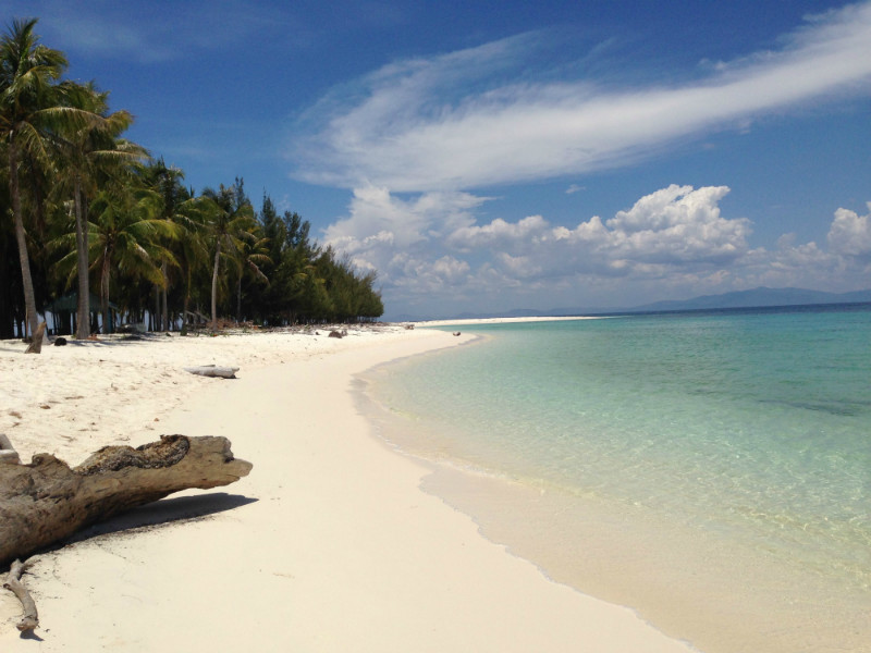 Beautiful scenes of blue sky and white sandy beach await visitors to Mantanani Island, Sabah.