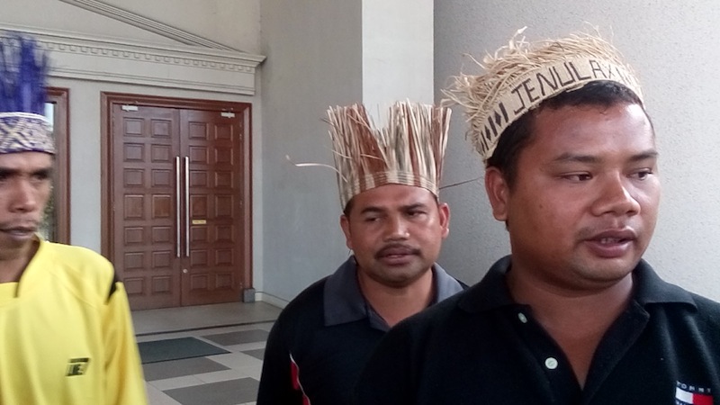 Jeffry Hassan (right) said the villagers who have been displaced from their homes in 7,600 hectares of ancestral land number over 1,000 people or 300 families.