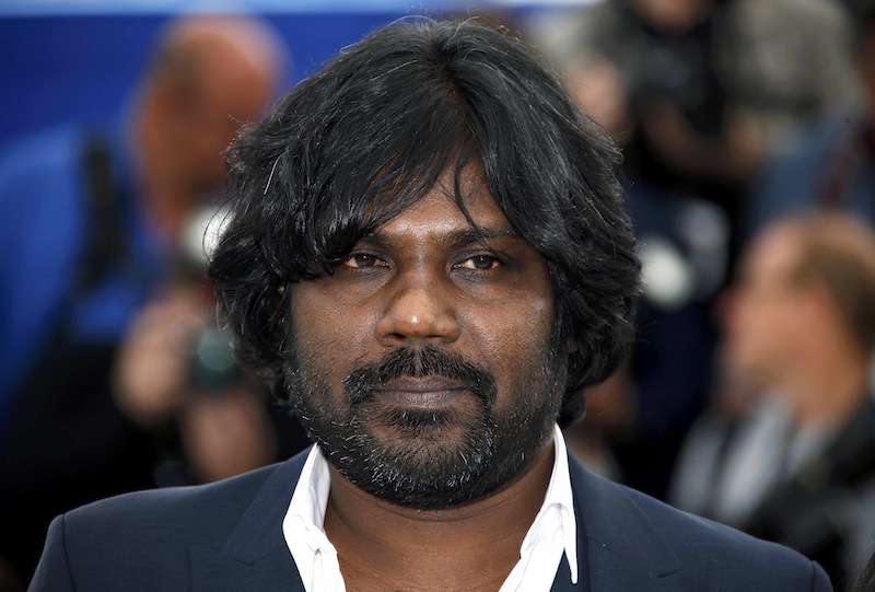 Cast member Jesuthasan Antonythasan poses during a photocall for the film 'Dheepan' in competition at the 68th Cannes Film Festival in Cannes, southern France, May 21, 2015. u00e2u20acu201d Reuters pic