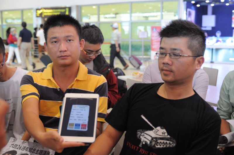 Suaram Penang coordinators Ong Jing Cheng and Richard Chin Kae Min (left) showing the ticket stub of the flight Joshua was sent back on at 12.55pm, May 26, 2015. u00e2u20acu2022 Picture by K. E. Ooi