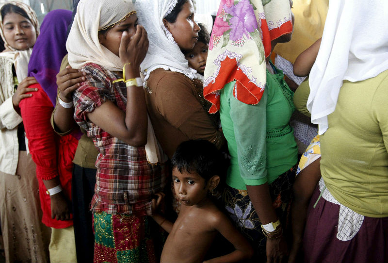 Rohingya women wait in line to receive donated Mukena, clothes to wear while praying, at a shelter in Kuala Langsa, in Indonesia's Aceh Province, May 18, 2015. u00e2u20acu201d Reuters pic