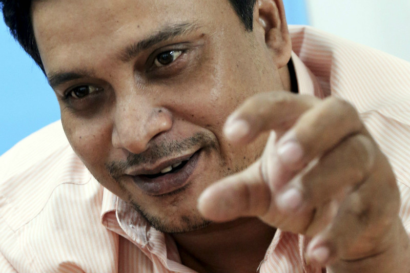 Soe Naing, who is widely known as Anwar, gestures after being arrested at the provincial police station in Nakhon Si Thammarat, southern Thailand April 28, 2015. — Reuters pic