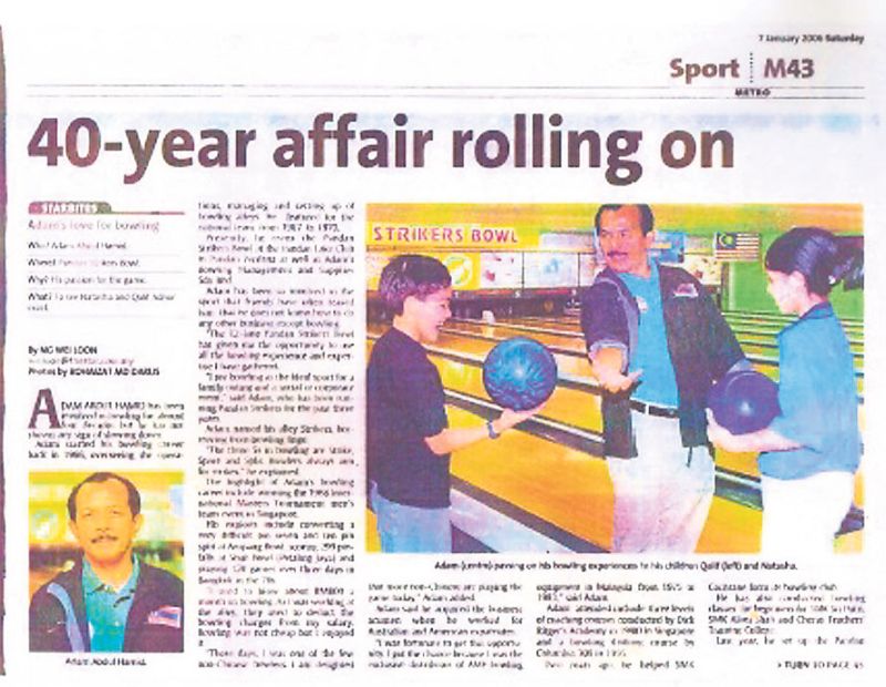 A newspaper cutting of Adam coaching his children. u00e2u20acu2022 Malay Mail pic