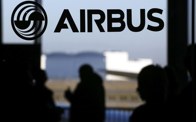People are silhouetted past a logo of the Airbus Group during the Airbus annual news conference in Colomiers, near Toulouse January 13, 2015. u00e2u20acu201d Reuters pic