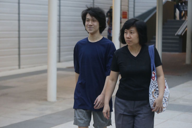 Amos Yee walks out of the State Courts in Singapore April 21, 2015. u00e2u20acu201d TODAY pic