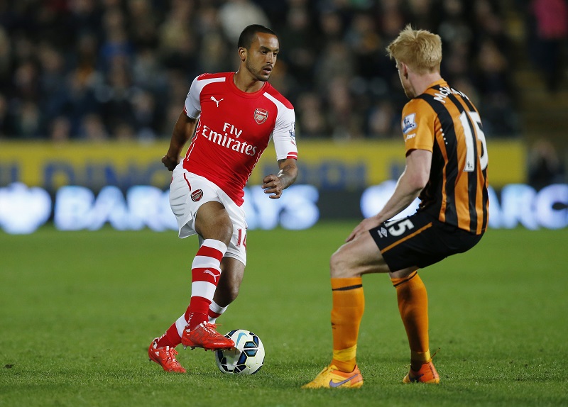 Arsenalu00e2u20acu2122s Theo Walcott in action with Hull Cityu00e2u20acu2122s Paul McShane at the Kingston Communications Stadium in Hull, May 5, 2015. u00e2u20acu201d Reuters pic