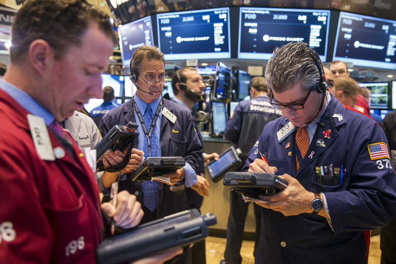 Traders work shortly after the opening bell on the floor of the New York Stock Exchange May 21, 2015. US stocks retreated slightly May 28,2015. u00e2u20acu201d Reuters pic
