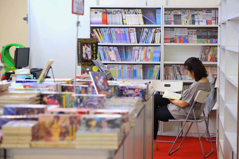 A woman reads a book while waiting for customers at the u00e2u20acu02dcLife is Beautifulu00e2u20acu2122 Book Fair at One City Mall in Petaling Jaya May 7, 2015. u00e2u20acu201d Picture by Saw Siow Feng