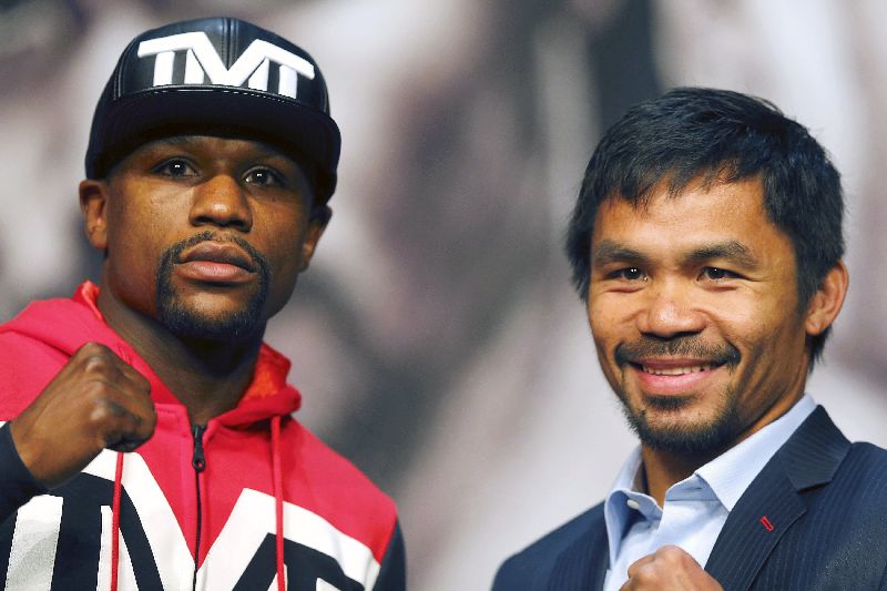 Undefeated WBC/WBA welterweight champion Floyd Mayweather Jr. (L) of the US and WBO welterweight champion Manny Pacquiao of the Philippines, final news conference, MGM Grand Resort in Las Vegas, Nevada, April 29, 2015. REUTERS/Las Vegas Sun/Steve Marcus
