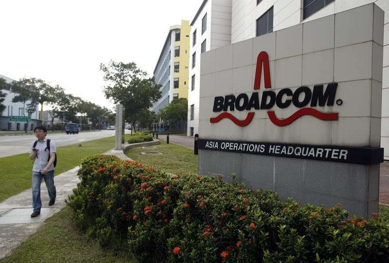 A man passes Broadcom's Asia operations headquarters office at an industrial park in Singapore September 16, 2014. u00e2u20acu201d Reuters pic