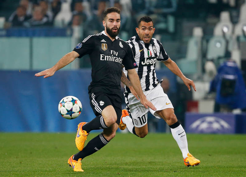 Real Madrid's Dani Carvajal (left) in action with Juventus' Carlos Tevez in the Champions League semi-final at Turin, May 5, 2015. u00e2u20acu201d Reuters pic