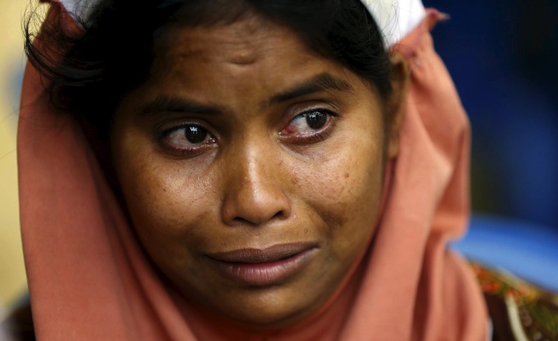 A Rohingya woman cries as her child is treated for malnutrition by a Malaysian medical team a day after they landed at Pantai Pasir Berdengung beach in Langkawi island, in the Malaysia's northern state of Kedah, Malaysia, May 12, 2015. u00e2u20acu201d Reuters pic