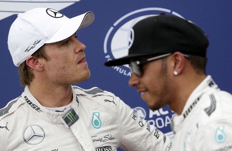 Mercedes Formula One teammates Nico Rosberg and Lewis Hamilton at the end of the qualifying session at the Monaco F1 Grand Prix May 23, 2015. Hamilton took pole ahead of Rosberg. REUTERS/Max Rossi