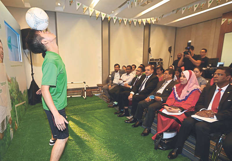 Guests being treated to a freestyle football performance at the launch of the u00e2u20acu02dcDo Something Amazingu00e2u20acu2122 campaign at Aloft Hotel, Kuala Lumpur. u00e2u20acu201d Pictures by Azneal Ishak