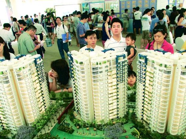Potential home buyers checking out residential properties offered by developers in Singapore. u00e2u20acu201d TODAY pic
