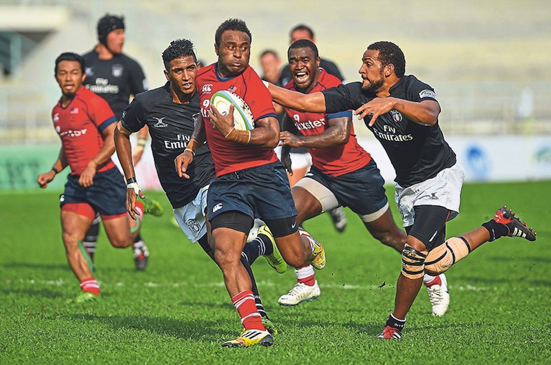 Malaysiau00e2u20acu2122s Isoa Vuluma Turuva escapes the grasp of a UAE player while making a forward foray. u00e2u20acu201d Picture by Firdaus Latif