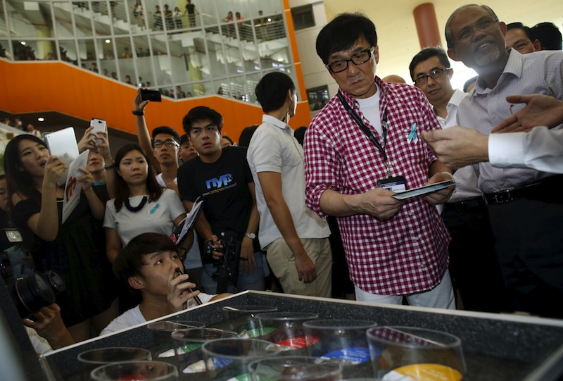 Singapore's new anti-drug ambassador, actor Jackie Chan looks at an exhibit of different types of drugs after launching an anti-drug mobile game application at Nanyang Polytechnic in Singapore May 7, 2015.u00c2u00a0u00e2u20acu201d Reuters pic