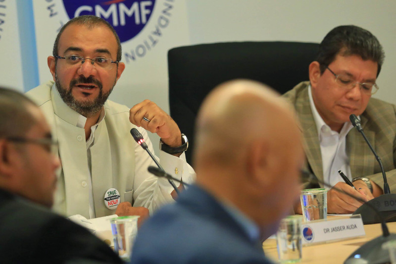 (From left) European Council for Fatwa and Research member Dr Jasser Auda and GMM Foundation chief Datuk Saifuddin Abdullah at the GMM roundtable discussion on 'Maqasid Al-Syariah' in Kuala Lumpur, on May 25, 2015. u00e2u20acu201d Picture by Saw Siow Fengn
