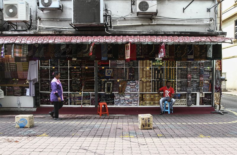 A man waits for customers at his shop in Jalan Masjid India in Kuala Lumpur, May 13, 2015. u00e2u20acu2022 Picture by Yusof Mat Isa