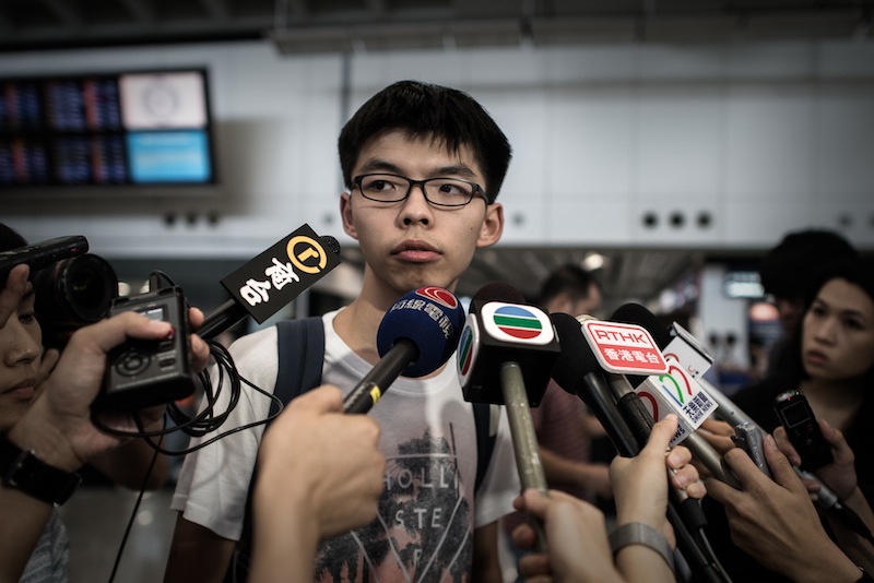 Hong Kong student leader Joshua Wong talks to the media at the international airport in Hong Kong on May 26, 2015. u00e2u20acu201du00c2u00a0AFP pic