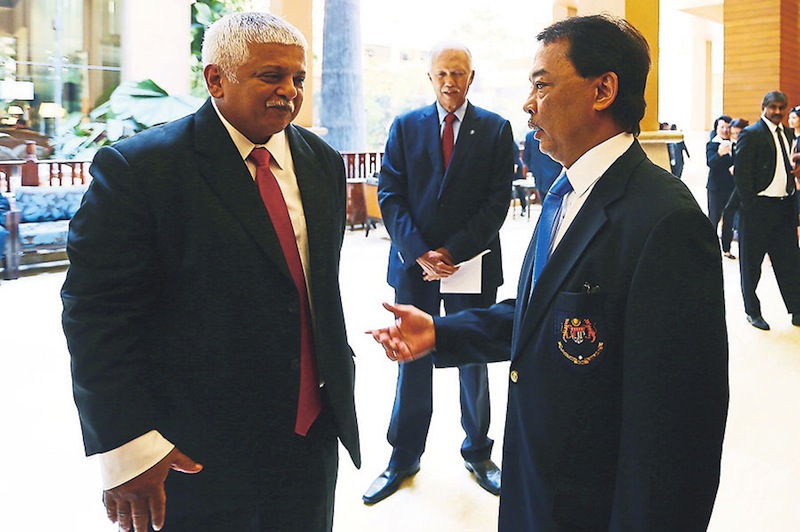 Tengku Abdullah (right) speaks to Koshy after the AGM. The former president has yet to deliver on his promise to clear MHCu00e2u20acu2122s debts. u00e2u20acu201d File pic