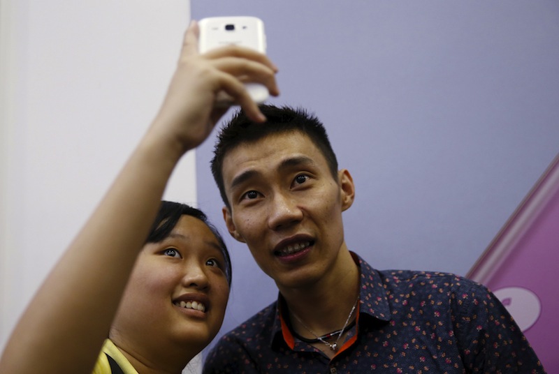 Malaysia's Lee Chong Wei (right) has a selfie with a fan in Kuala Lumpur, April 17, 2015. u00e2u20acu201d Reuters pic