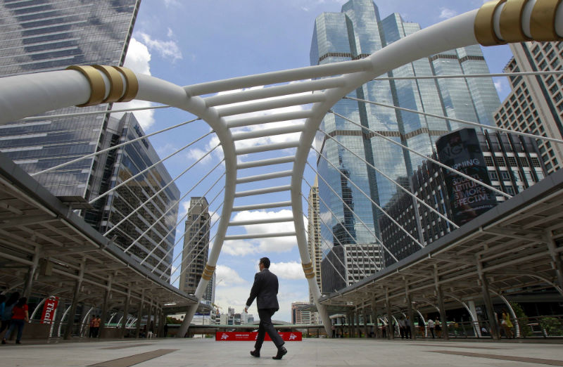 A man walks in a business area in Bangkok, Thailand, May 22, 2015. A year on, after Thailand's army seized power, the captains of Thai industry remain firmly behind the junta, despite a lacklustre economy. u00e2u20acu201d Reuters pic