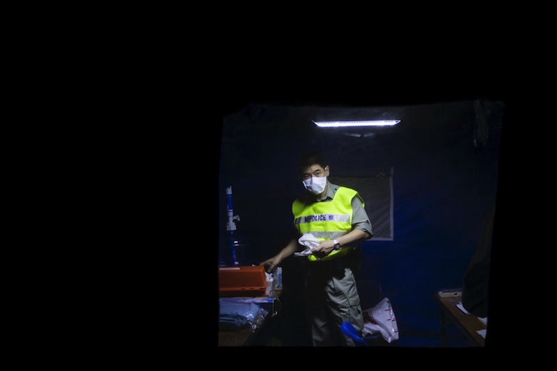 A police with mask stands guard outside Lady MacLehose Holiday Village in Sai Kung, where people who came into close contact with the South Korean MERS patient will spend two weeks in quarantine, in Hong Kong, China May 29, 2015. u00e2u20acu201d Reuters pic