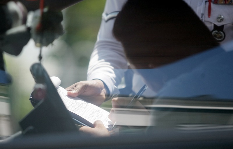 A motorist receives a traffic summons on the second day of Ops Warta 2015 in Kuching, May 20, 2015. u00e2u20acu201d Bernama pic