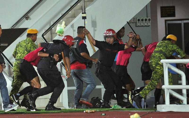 Security forces had to accompany referees after Terengganu fans threw objects after the FA Cup semi-final second leg match at the Sultan Mizan Zainal Abidin Stadium, Kuala Nerus, Terengganu, May 16, 2015. u00e2u20acu201d Bernama pic