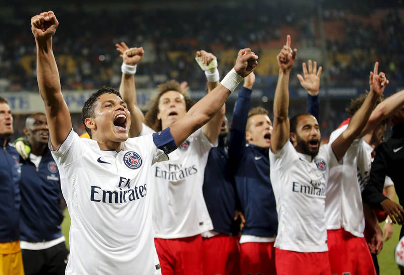 Paris St Germain's players celebrate at the end of their French Ligue 1 soccer match against Montpellier, May 16, 2015. u00e2u20acu201d Reuters pic
