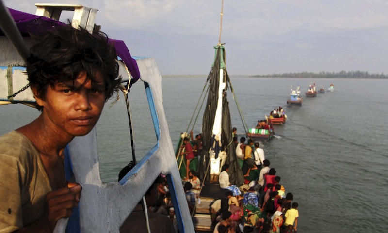 A fishing boat carrying Rohingya and Bangleshi migrants is pulled to shore by Achenese fisherman off the coast of Julok, in Aceh province May 20, 2015 in this photo taken by Antara Foto. u00e2u20acu201d Reuters pic