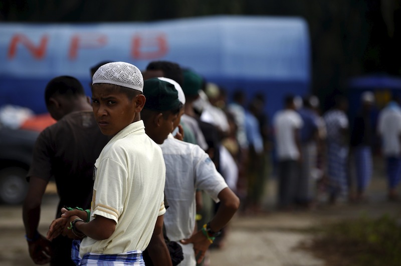 Rohingya migrants who arrived in Indonesia last week by boat wait in line for breakfast at a temporary shelter in Aceh Timur regency near Langsa in Indonesia's Aceh Province May 27, 2015.u00c2u00a0u00e2u20acu201d Reuters pic